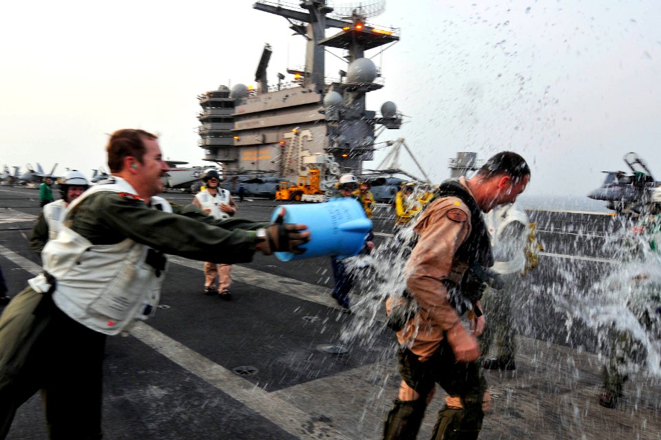 US Navy 110629-N-EE987-304 Lt. Cmdr. Matthew Stoll, a pilot assigned to the Argonauts of Strike Fighter Squadron (VFA) 147, is congratulated after
