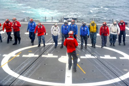US Navy 110626-N-PB383-001 Sailors assigned to the guided-missile frigate USS McClusky (FFG 41) conduct a foreign object damage walk down