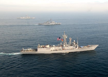 US Navy 110629-N-ZI300-042 USS Thach (FFG 43), front, BAP Mariategui (FM 54), center, and USS Boone (FFG 28) move into formation for a photo exerci