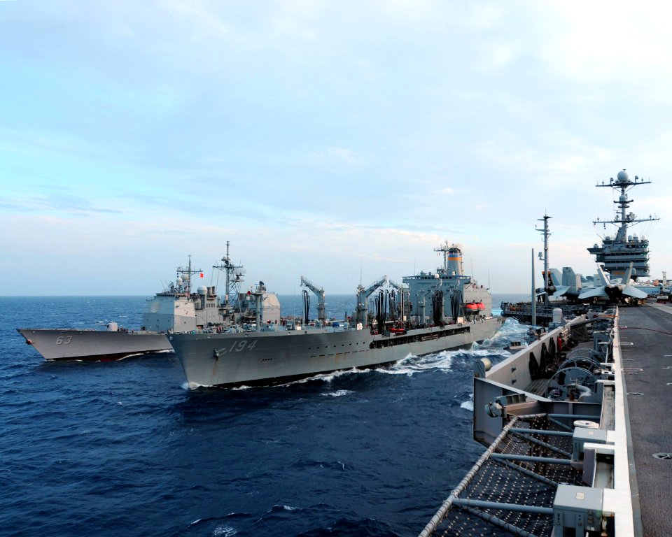 US Navy 110627-N-DS193-031 The aircraft carrier USS George Washington (CVN 73), right, and the guided-missile cruiser USS Cowpens (CG 63), left, co