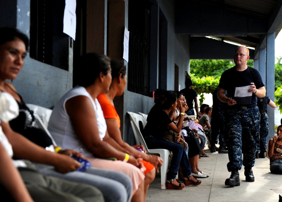 US Navy 110630-F-ET173-229 Hospital Corpsman 3rd Class Shannon Sensenig takes a patient's medical records to a physician at the Los Angeles surgica