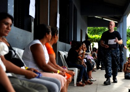 US Navy 110630-F-ET173-229 Hospital Corpsman 3rd Class Shannon Sensenig takes a patient's medical records to a physician at the Los Angeles surgica photo