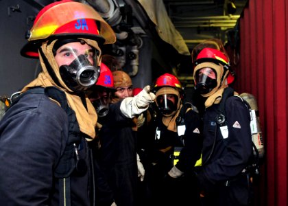 US Navy 110628-N-ZF681-023 Sailors spot a fire during a fire drill aboard SS Cleveland (LPD 7) photo