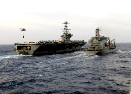 US Navy 110627-N-KB052-292 The aircraft carrier USS George Washington (CVN 73) approaches the Military Sealift Command fleet replenishment oiler US
