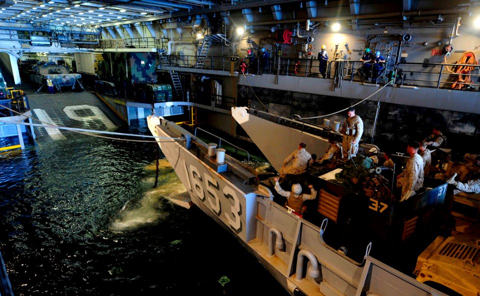 US Navy 110627-N-OS574-134 A landing craft utility (LCU) assigned to Assault Craft Unit (ACU) 2 off-loads passengers and equipment aboard the San A