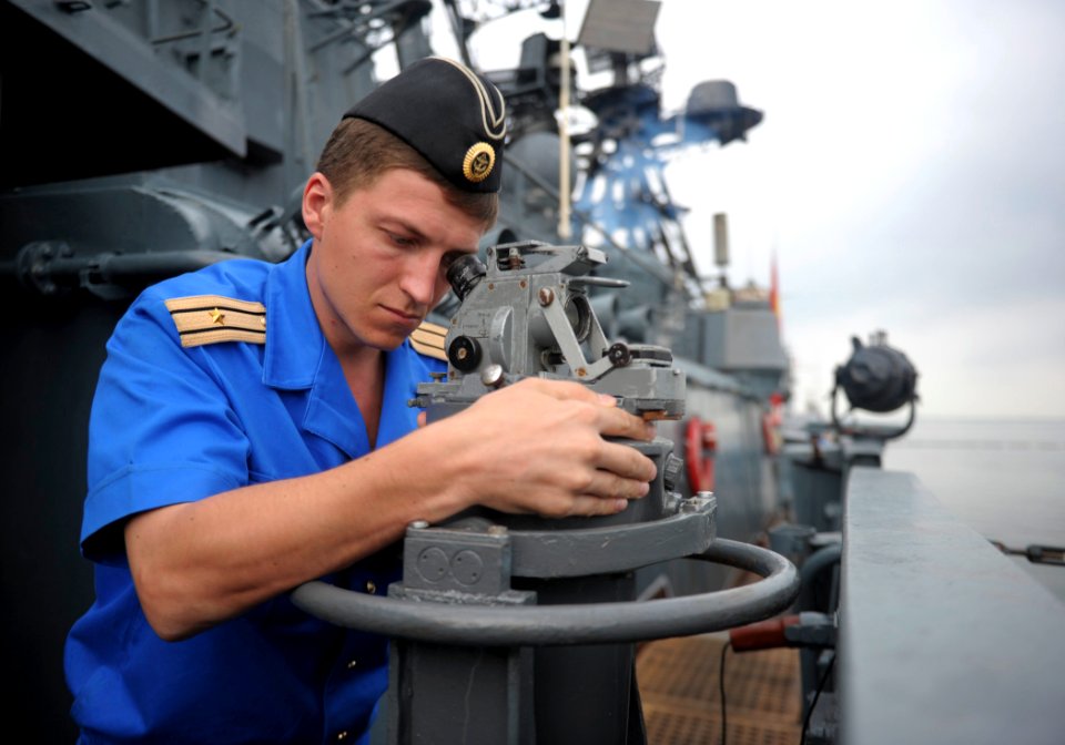 US Navy 110627-N-XZ912-020 A Russian sailor assigned to the Russian navy destroyer RFS Admiral Chabanenko (DD 650) plots a course as the Admiral Ch