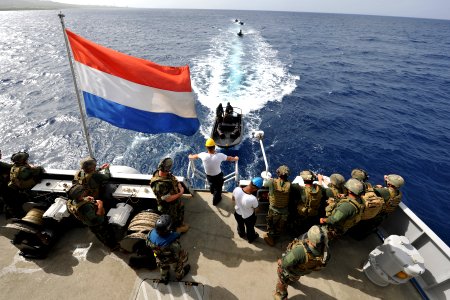 US Navy 110628-N-YO394-044 Sailors assigned to Riverine Squadron (RIVRON) 3 prepare to board small boats during a stern touch and go exercise aboar