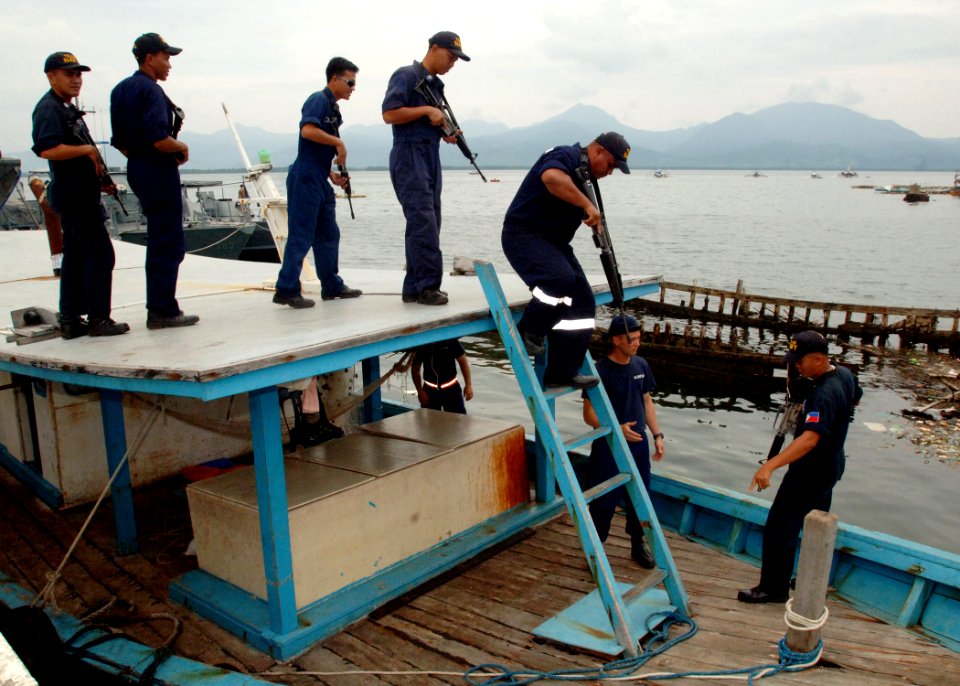 US Navy 110701-N-NJ145-300 Philippine navy sailors board a fishing vessel during a tactical boarding training exercise with U.S. Coast Guard Mariti