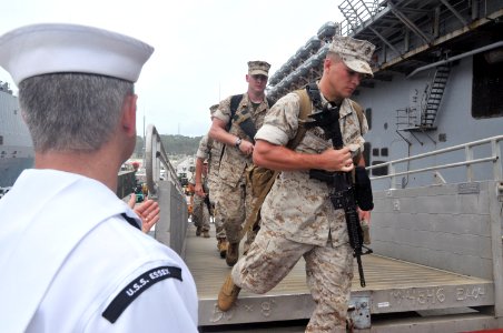 US Navy 110627-N-ZZ999-007 Marines assigned to the 31st Marine Expeditionary Unit (31st MEU) board the forward deployed amphibious assault ship USS