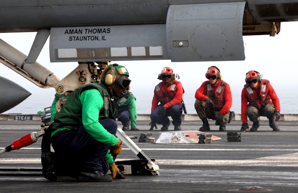 US Navy 110703-N-KF029-035 Sailors prepare aircraft for launch aboard the aircraft carrier USS Ronald Reagan (CVN 76)