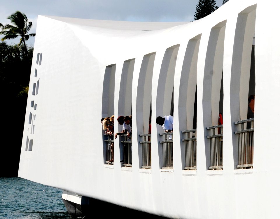 US Navy 110703-N-WX059-130 Sailors and family members observe the USS Arizona Memorial while on a boat tour of Pearl Harbor