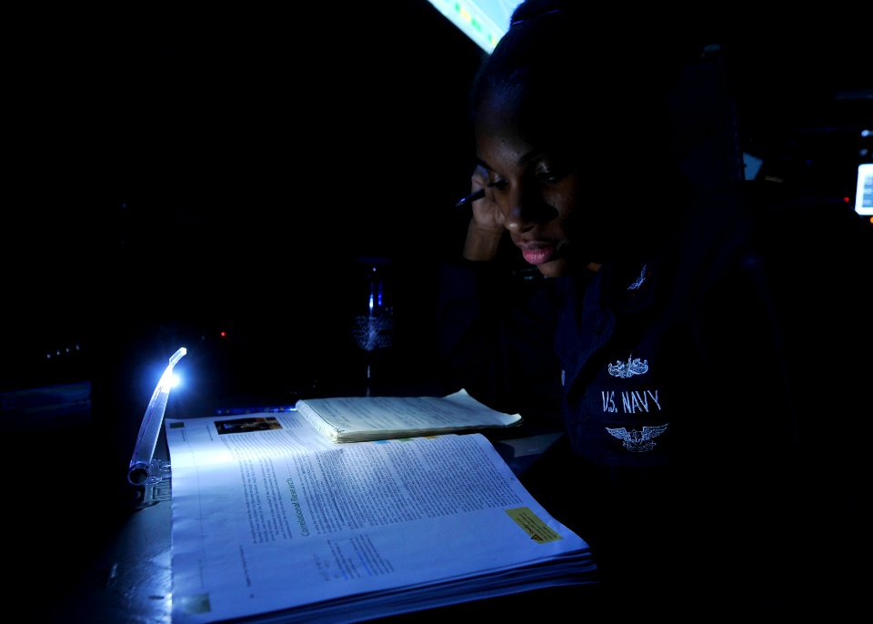 US Navy 110702-N-EE987-049 Fire Controlman 2nd Class Lisa Smith, from Hartford, Ct., studies for a psychology test aboard the aircraft carrier USS