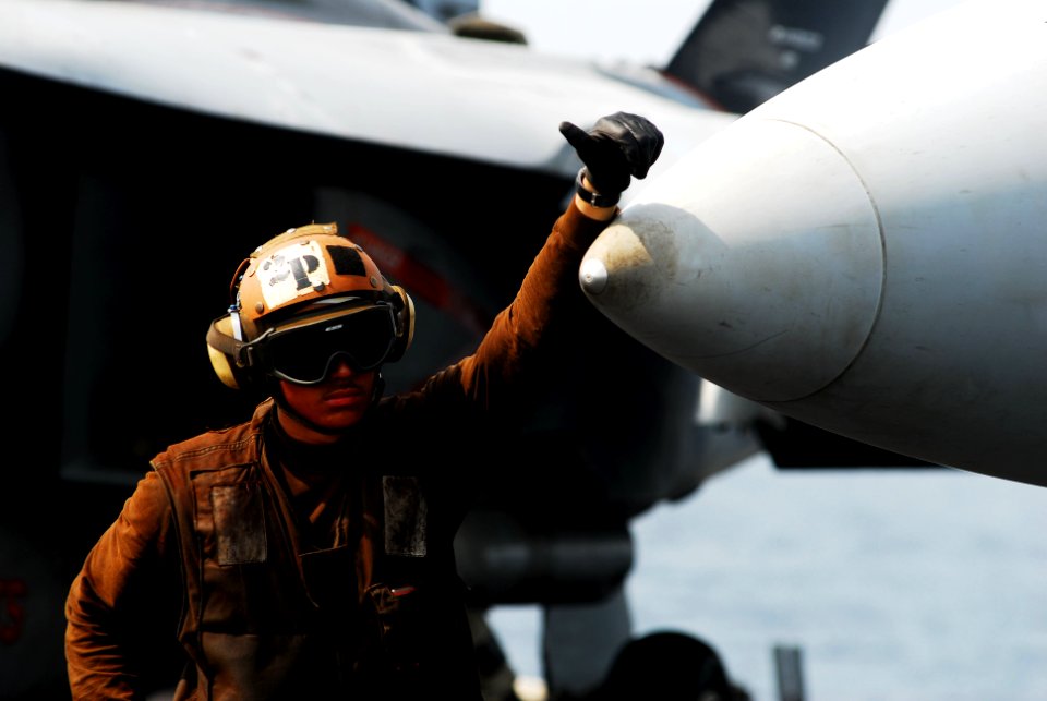 US Navy 110630-N-GL340-008 A plane captain stands by for flight operations aboard the aircraft carrier USS Ronald Reagan (CVN 76)