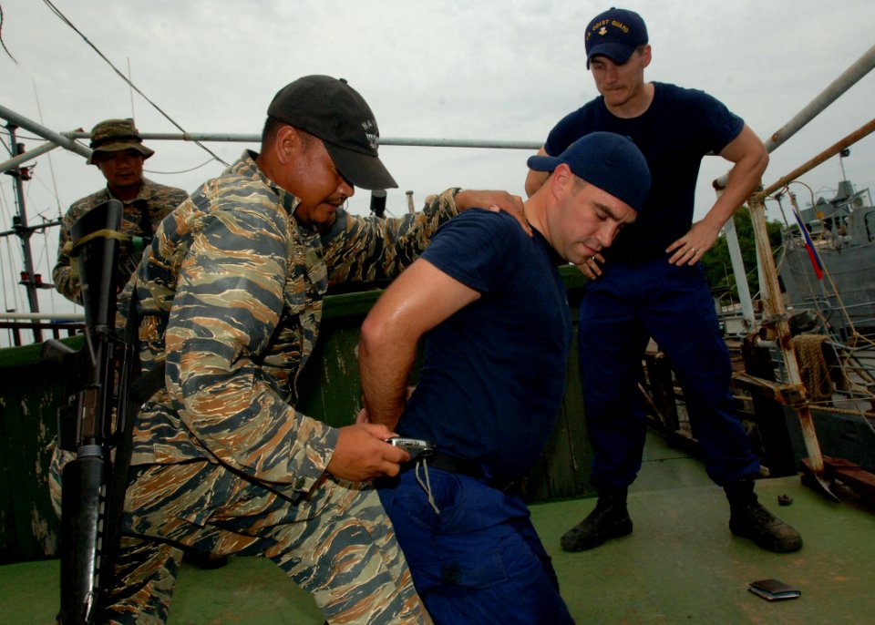 US Navy 110701-N-NJ145-261 Philippine navy sailors practice search and detain operations while participating in a tactical boarding training exerci