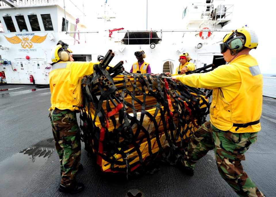 US Navy 110630-N-QD416-048 Sailors aboard the Military Sealift Command hospital ship USNS Comfort (T-AH 20) prepare supplies for transfer to a medi