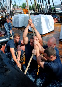 US Navy 110629-N-SH953-468 Sailors sweat the port side halyard to the main topsail yard aboard USS Constitution for the first time since the ship b
