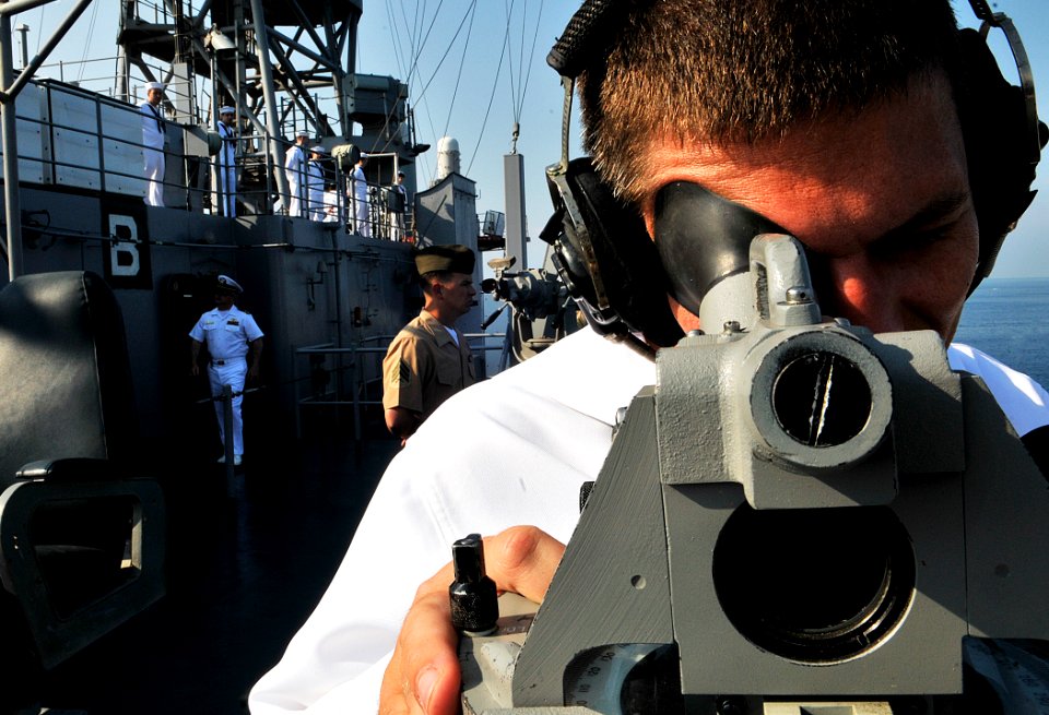 US Navy 110703-N-AG285-130 Quartermaster 3rd Class Christopher Koch uses a sound-powered telephone aboard USS Whidbey Island (LSD 41)