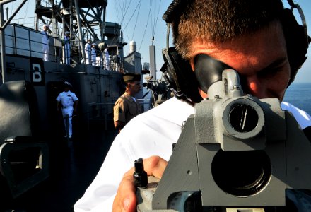 US Navy 110703-N-AG285-130 Quartermaster 3rd Class Christopher Koch uses a sound-powered telephone aboard USS Whidbey Island (LSD 41)