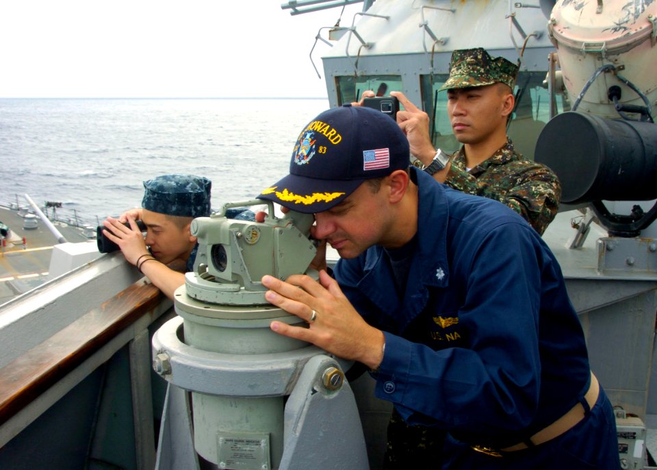US Navy 110705-N-VY256-046 David Zook, executive officer of the guided-missile destroyer USS Howard (DDG 83) watches U.S. and Philippine navy ships