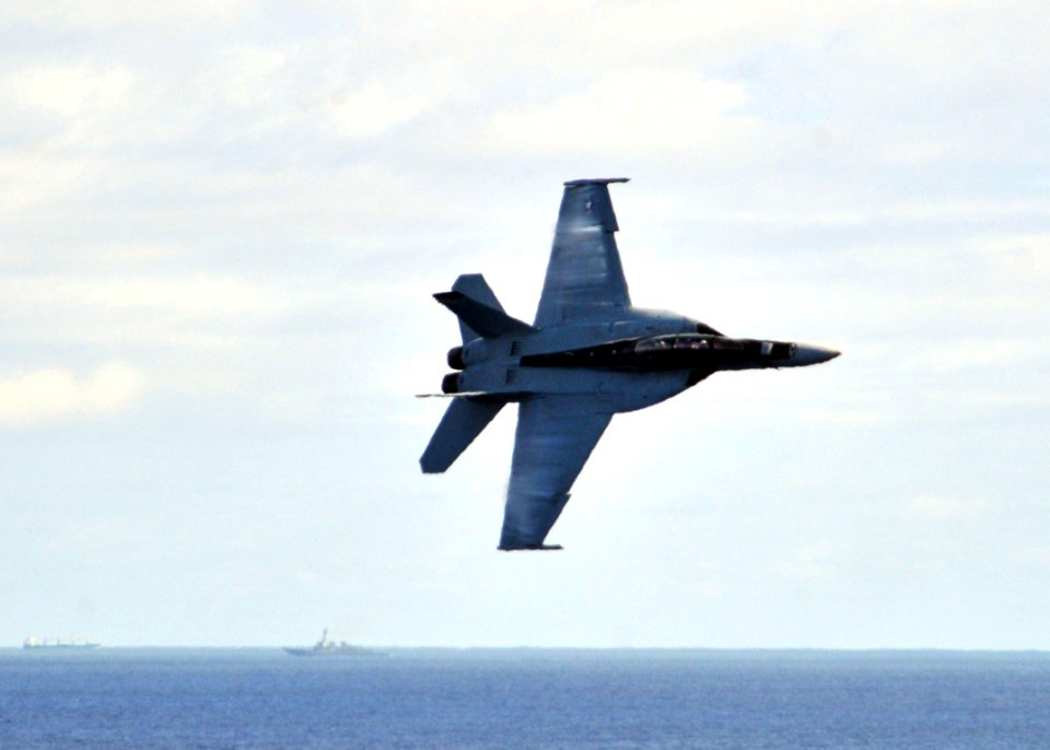 US Navy 110706-N-CH661-087 An F-A-18F Super Hornet assigned to the Checkmates of Strike Fighter Squadron (VFA) 211 performs a high-speed flyby duri