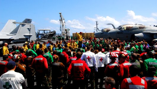 US Navy 110702-N-AW206-041 Aviation Boatswain's Mate (Handling) 1st Class Jackie Velasco briefs Sailors following a barricade drill aboard USS Geor