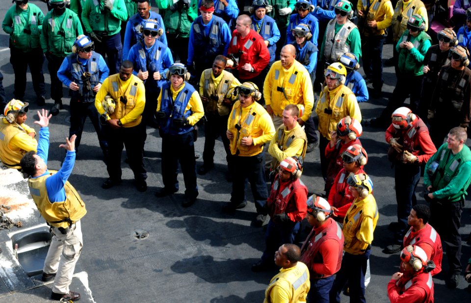 US Navy 110706-N-QL471-084 Senior Chief Aviation Boatswain's Mate (Handling) Martin Jimenez gives Sailors a safety briefing before flight deck safe