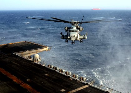 US Navy 110630-N-KA046-003 An MH-53E Super Stallion helicopter approaches the flight deck of USS Bataan (LHD 5) during flight operations