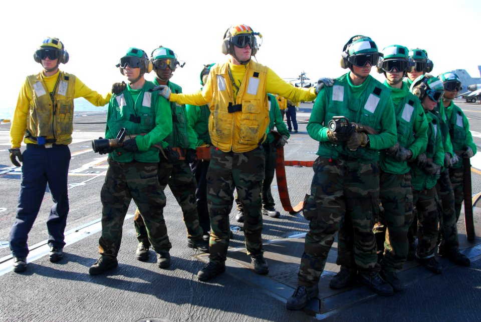 US Navy 110705-N-AW206-020 Sailors fight a simulated fire during a mass casualty drill aboard USS George Washington (CVN 73)