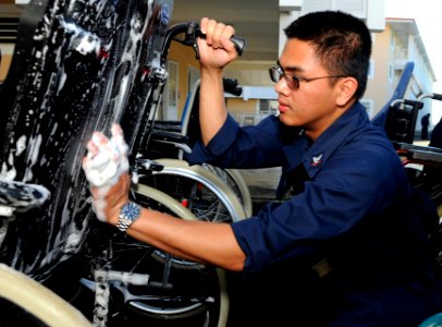 US Navy 110705-N-XG305-404 Hospital Corspman 3rd Class Paul Amores, assigned to the U.S. 7th Fleet command ship USS Blue Ridge (LCC 19), cleans a w
