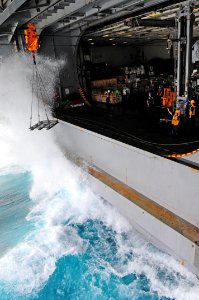 US Navy 110630-N-UO379-040 Sailors aboard the aircraft carrier USS Ronald Reagan (CVN 76) send an empty transport hoist to the Military Sealift Com