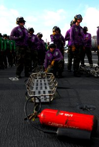 US Navy 110705-N-AW206-005 tretcher bearers stand by for instruction during a mass casualty drill aboard USS George Washington (CVN 73)