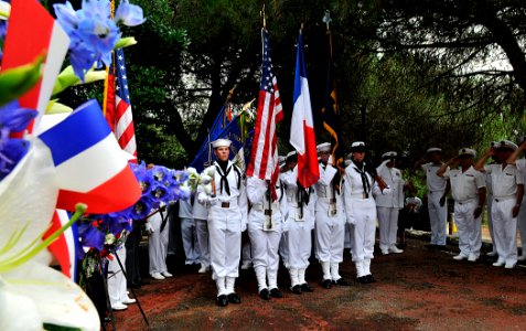 US Navy 110704-N-AG285-181 The color guard from the amphibious dock landing ship USS Whidbey Island (LSD 41) stands at attention during a memorial