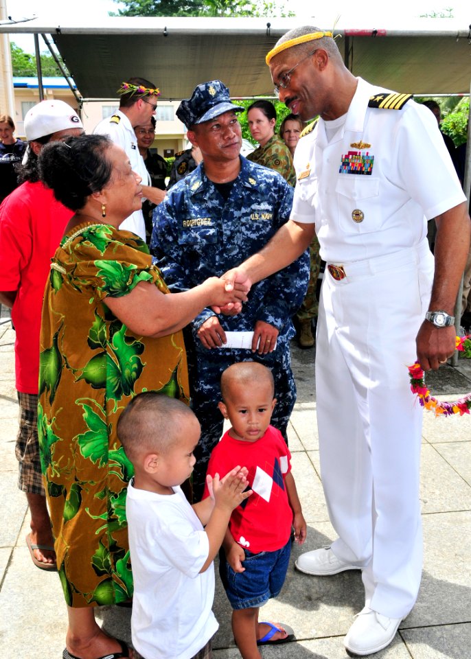 US Navy 110704-N-ZF681-582 Capt. Jesse A. Wilson meets the family of Chief Machinist's Mate Salper Rodriguez during the opening ceremony for Pacifi