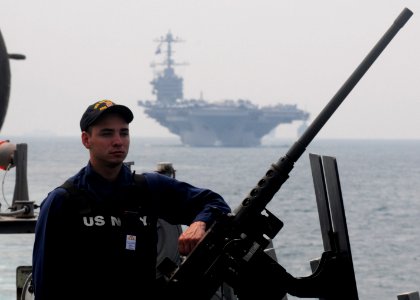 US Navy 110706-N-IO627-134 Gunner's Mate Seaman Keith Ford mans a .50 caliber gun aboard USS Curtis Wilbur (DDG 54)