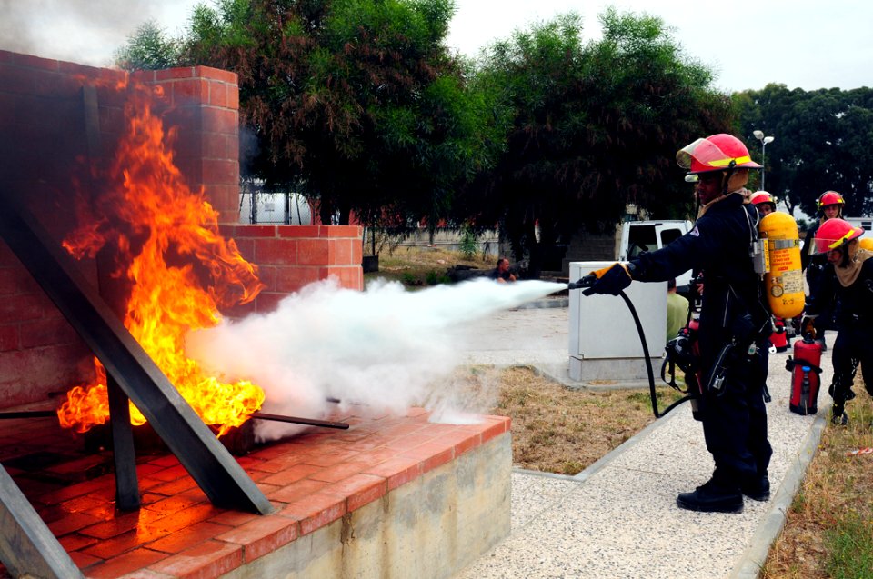 US Navy 110701-N-NR955-057 Sailors assigned to the guided-missile destroyer USS Bulkeley (DDG 84) put out a grease fire during a training exercise