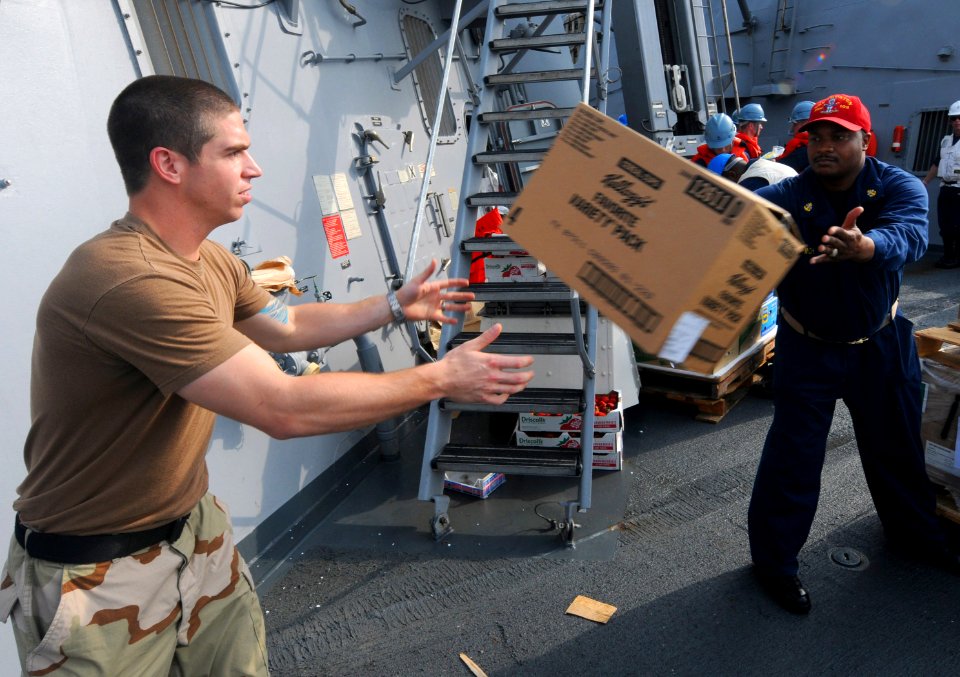 US Navy 110707-N-TB177-242 Electrician's Mate 2nd Class Troy Laliberte, left, and Chief Damage Controlman Lamanski Finch participate in a working p
