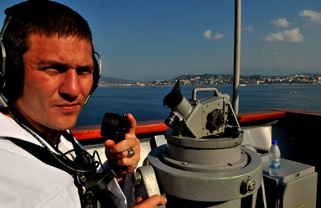 US Navy 110703-N-AG285-126 Quartermaster 3rd Class Christopher Koch uses a sound-powered telephone aboard USS Whidbey Island (LSD 41)
