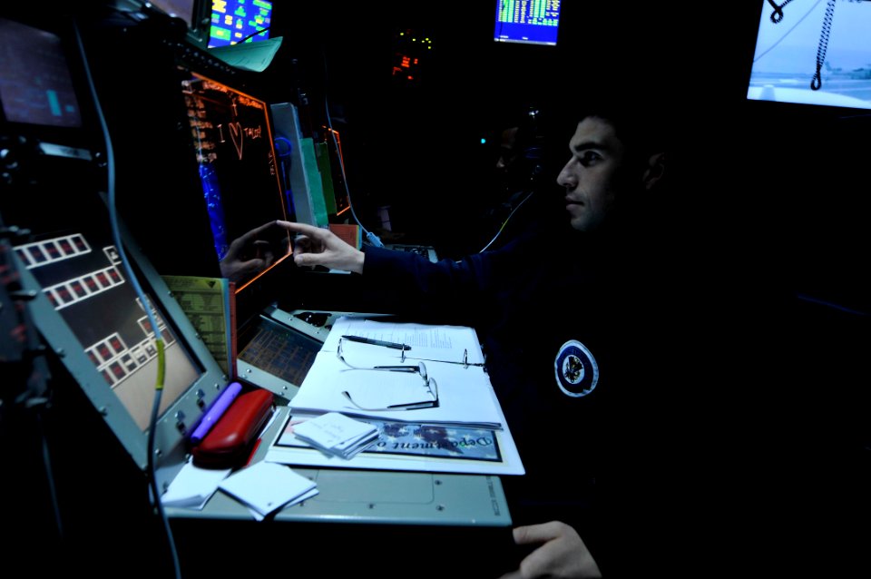 US Navy 110702-N-EE987-044 Operations Specialist 3rd Class David Gomez, from San Diego, tracks aircraft aboard the aircraft carrier USS Ronald Reag