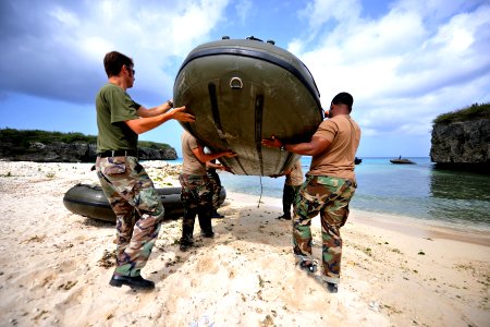 US Navy 110705-N-YO394-010 Sailors and Royal Netherlands marines carry an inflatable raft into the water in preparation for the start of a six-kilo