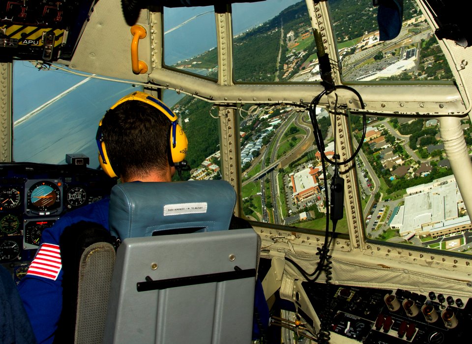 US Navy 110706-N-BA418-009 Marine Capt. Benjamin Blanton looks over Naval Air Station Pensacola while flying in preparation for the 2011 Pensacola