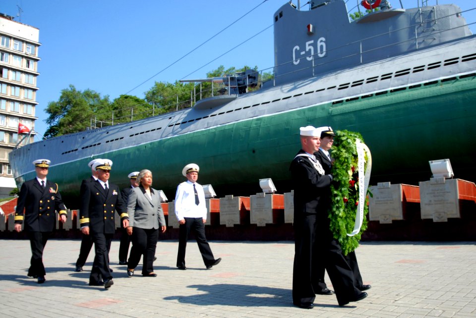 US Navy 110704-N-MU720-074 Sailors carry a ceremonial wreath ahead of the official party during a wreath laying ceremony in Vladivostok, Russia
