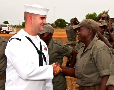 US Navy 110704-N-XK513-166 Sonar Technician (Surface) 2nd Class Jay D. Au from the High Speed Vessel Swift (HSV 2) congratulates a graduate of Gabo