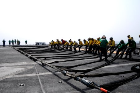 US Navy 110706-N-TU894-209 Sailors set up the emergency barricade during flight deck training drills aboard USS George H.W. Bush (CVN 77)
