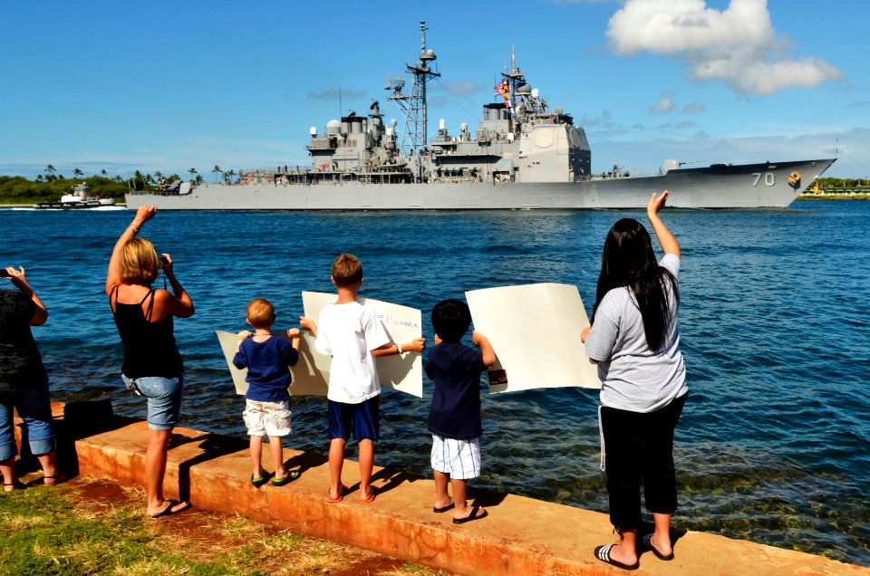 US Navy 110706-N-WP746-364 Families and friends along Aloha Aina Park at Joint Base Pearl Harbor-Hickam welcome home the guided-missile cruiser USS