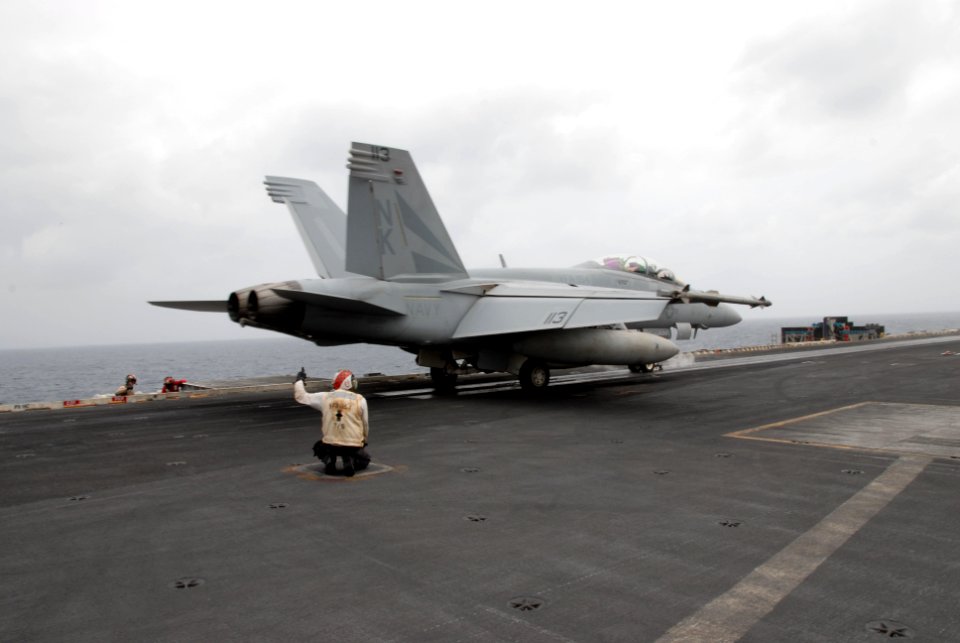US Navy 110709-N-KF029-097 An F-A-18F Super Hornet assigned to the Black Knights of Strike Fighter Squadron (VFA) 154 catapults from the aircraft c