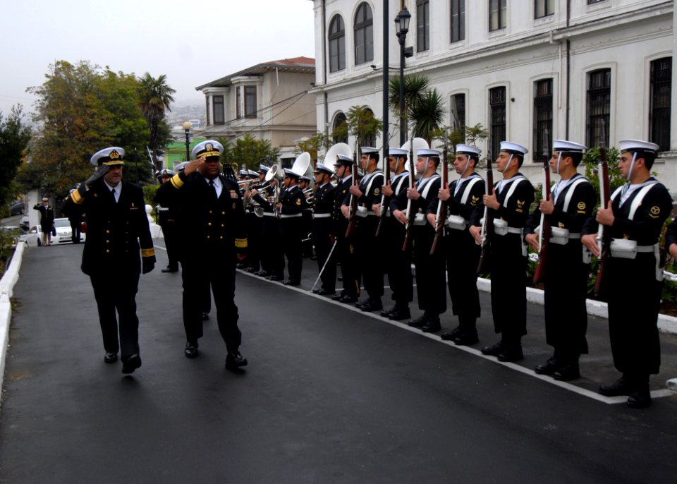 US Navy 110708-N-ZI300-011 UNITAS 52 leasers return salutes to an honor guard as they arrive at the closing ceremony for the Pacific phase of UNITA