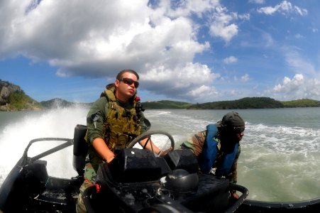 US Navy 110707-N-YO394-088 Gunner's Mate 3rd Class Cory Sanchez, assigned to Riverine Squadron (RIVRON) 3, practices high-speed turns under the ins photo