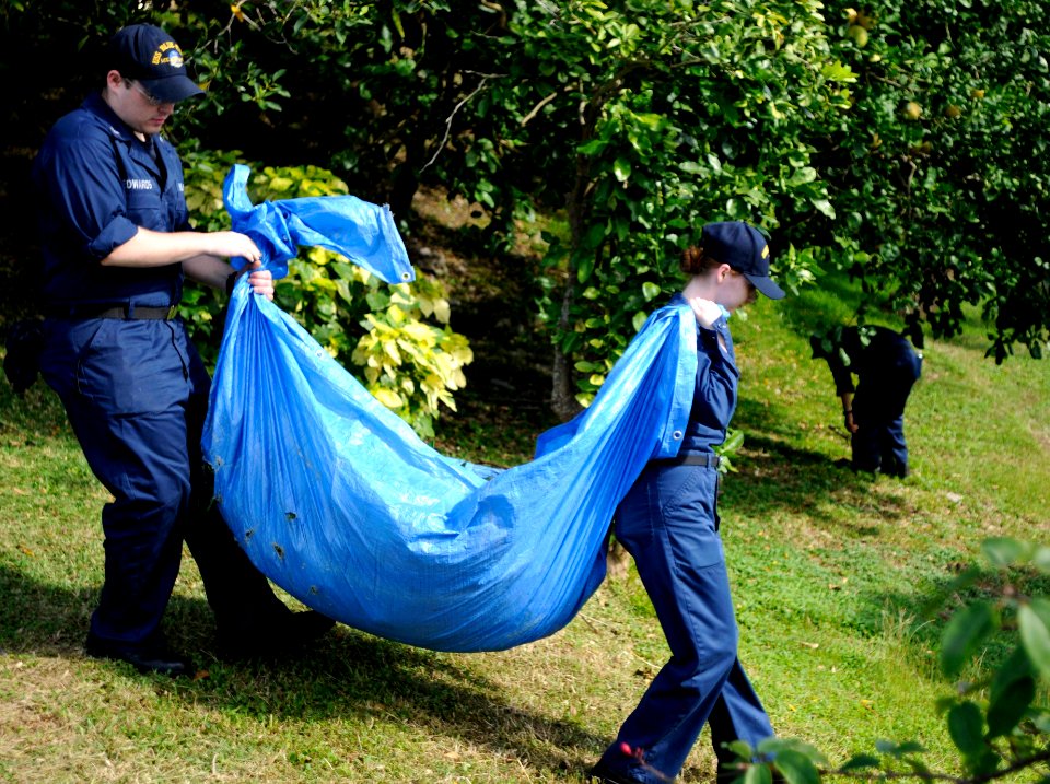 US Navy 110705-N-XG305-407 Sailors carry leaves during a community service project at the Little Sisters of the Poor retirement home