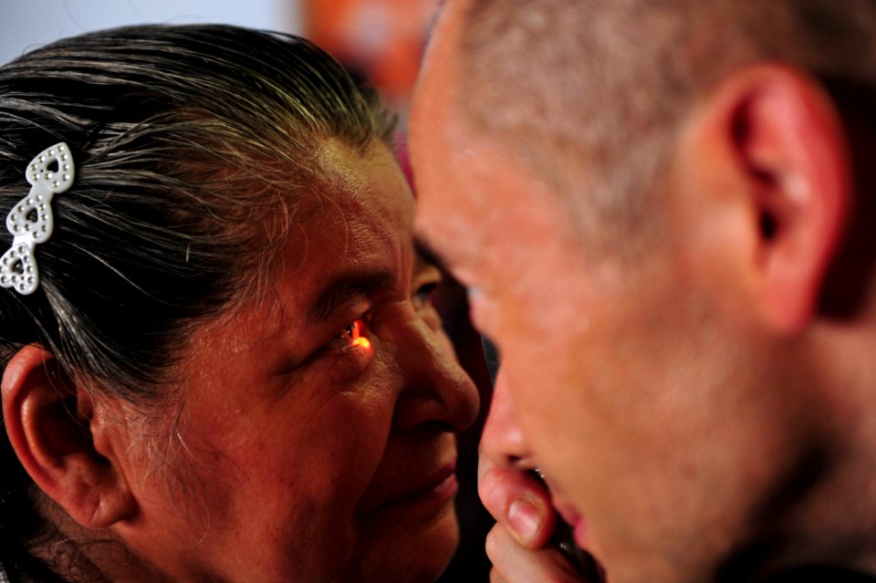 US Navy 110706-F-NJ219-218 Lt. Cmdr. Robert Franks, an optometrist from Vacaville, Calif., checks a patient's vision during a Continuing Promise 20