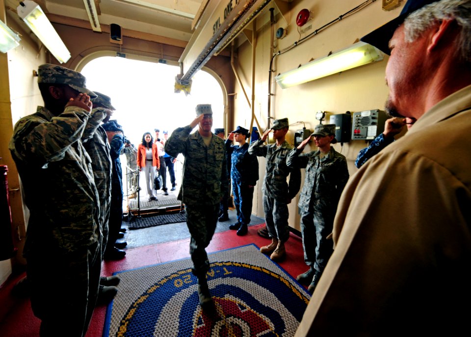 US Navy 110707-N-EP471-001 Air Force Gen. Douglas Fraser salutes civilian Master Capt. Randall Rockwood, assigned to the Military Sealift Commmand